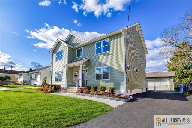 a view of a hallway with windows and chandelier