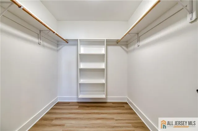 a view of a house with wooden fence