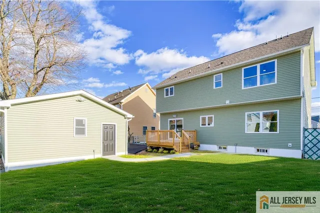 a view of a house with a backyard and porch