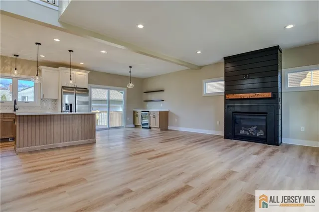 a view of kitchen and kitchen with furniture wooden floor and window