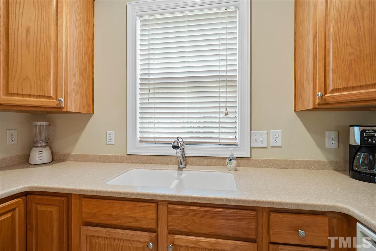 2632 Andover Glen Road Raleigh, NC 27604 - Photo 11 of 23 a kitchen with a sink and cabinets