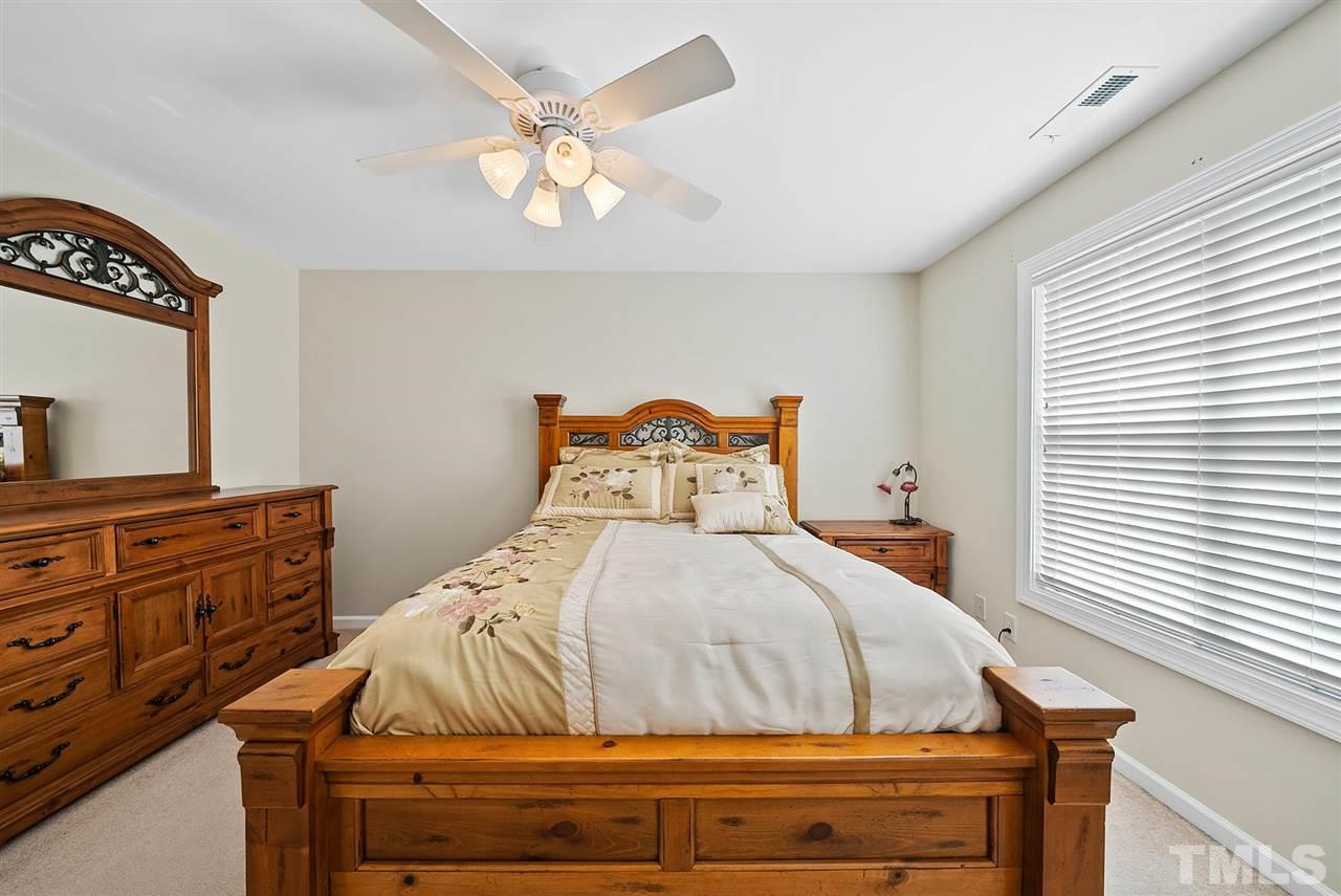 2632 Andover Glen Road Raleigh, NC 27604 - Photo 17 of 23 a bedroom with a bed and a dresser