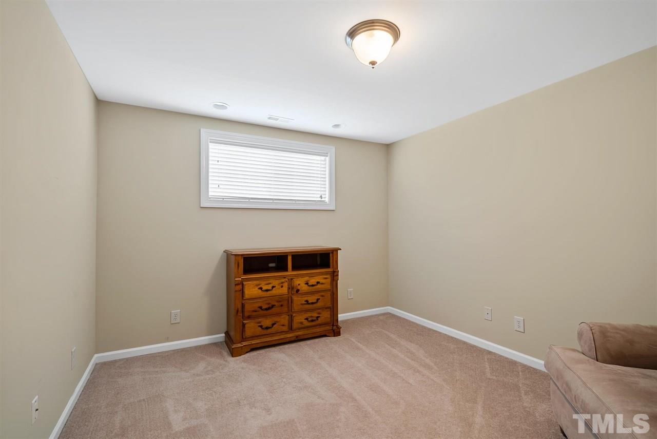 2632 Andover Glen Road Raleigh, NC 27604 - Photo 20 of 23 an empty room with a fireplace