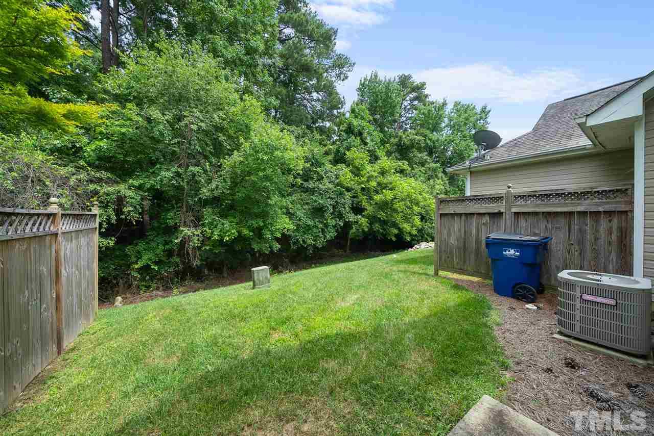 2632 Andover Glen Road Raleigh, NC 27604 - Photo 5 of 23 a view of backyard with plants and outdoor seating