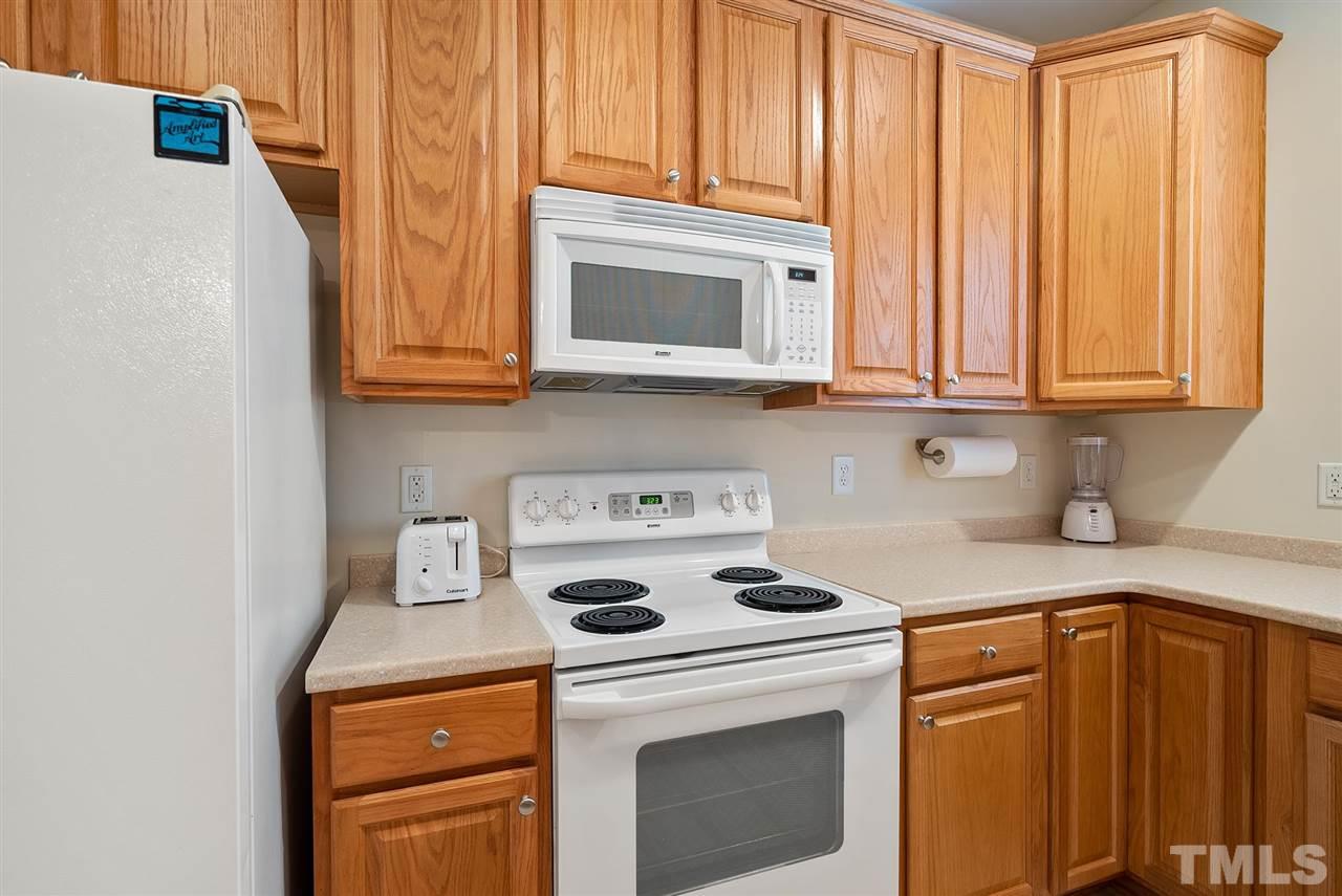 2632 Andover Glen Road Raleigh, NC 27604 - Photo 10 of 23 a kitchen with stainless steel appliances granite countertop a refrigerator and a stove top oven