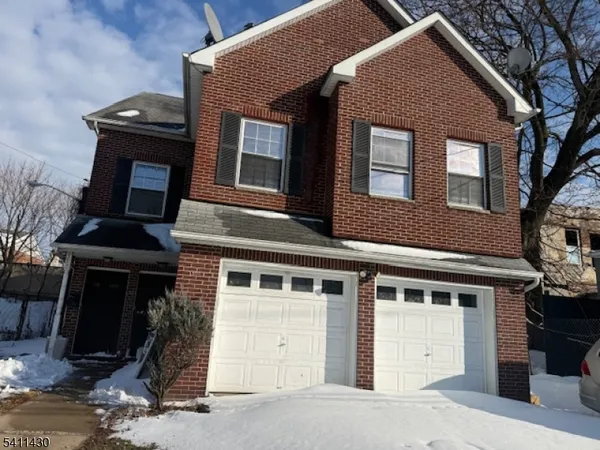 a front view of a house with a garage