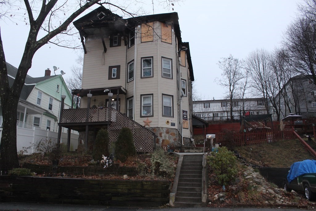 119 Rodney Street Worcester, MA 01605 - Photo 1 of 21 a front view of a house with garden