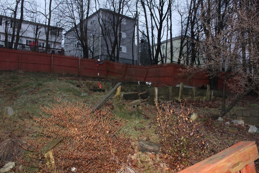 119 Rodney Street Worcester, MA 01605 - Photo 20 of 21 a backyard of a house with lots of green space