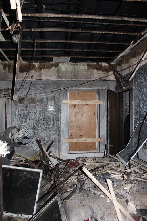 119 Rodney Street Worcester, MA 01605 - Photo 9 of 21 a room with water heater and a wooden cabinets