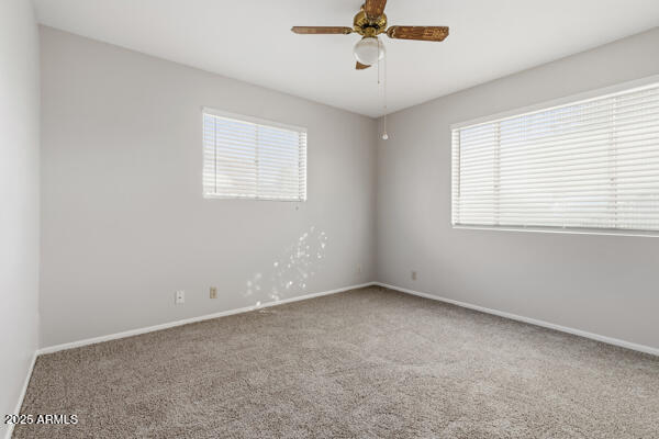 6117 East Decatur Street Mesa, AZ 85205 - Photo 16 of 29 a view of an empty room with a window