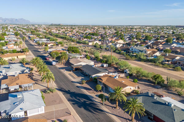 6117 East Decatur Street Mesa, AZ 85205 - Photo 28 of 29 an aerial view of a city with lots of residential buildings