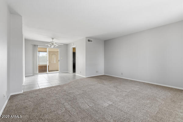 6117 East Decatur Street Mesa, AZ 85205 - Photo 7 of 29 a view of empty room with wooden floor