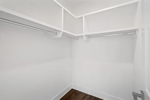 a view of an empty walk in closet