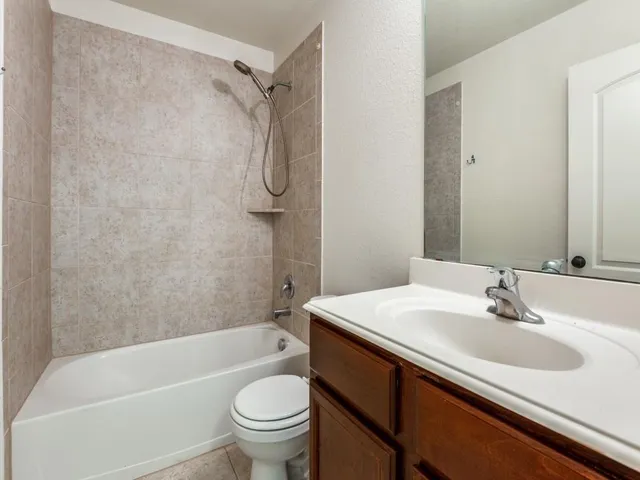 a bathroom with a sink a toilet and a bathtub