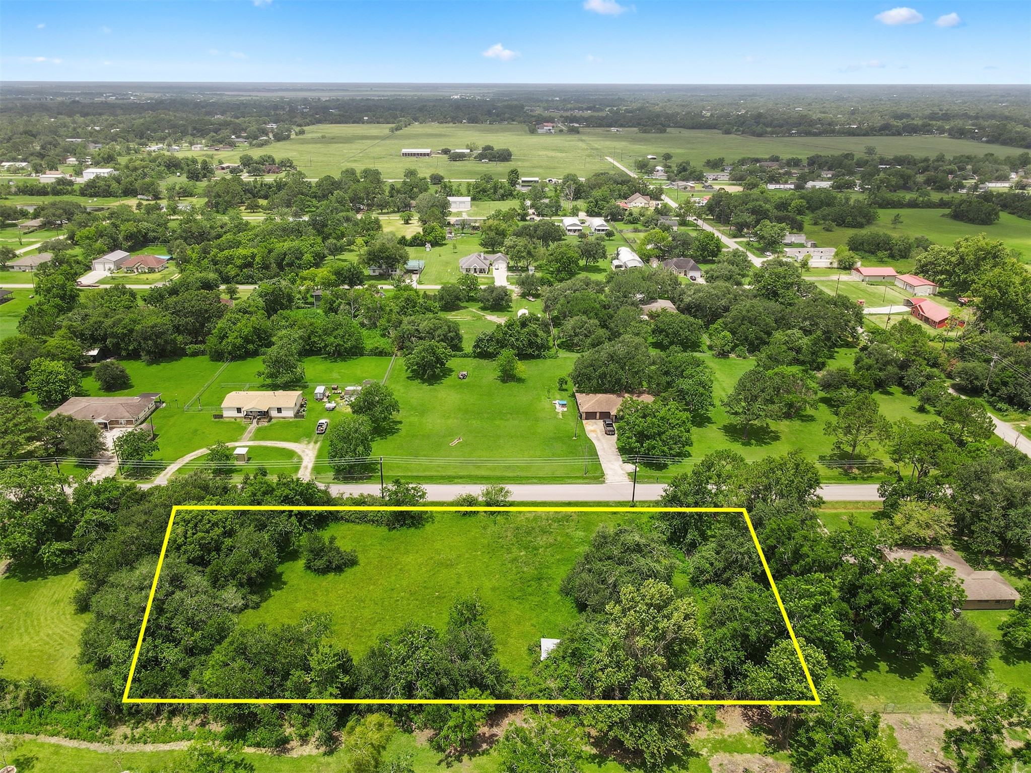 0 Avenue T Santa Fe, TX 77510 - Photo 2 of 9 an aerial view of residential houses with outdoor space and trees