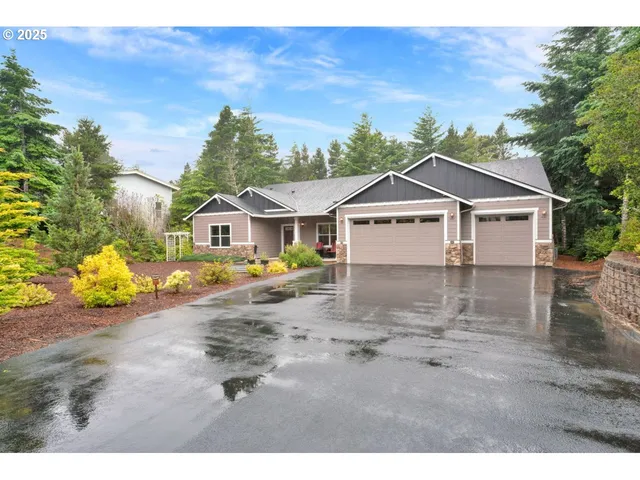 a view of a house with a wooden deck