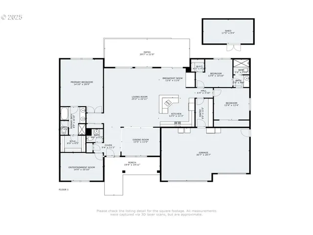 an aerial view of a house with garden space and trees all around