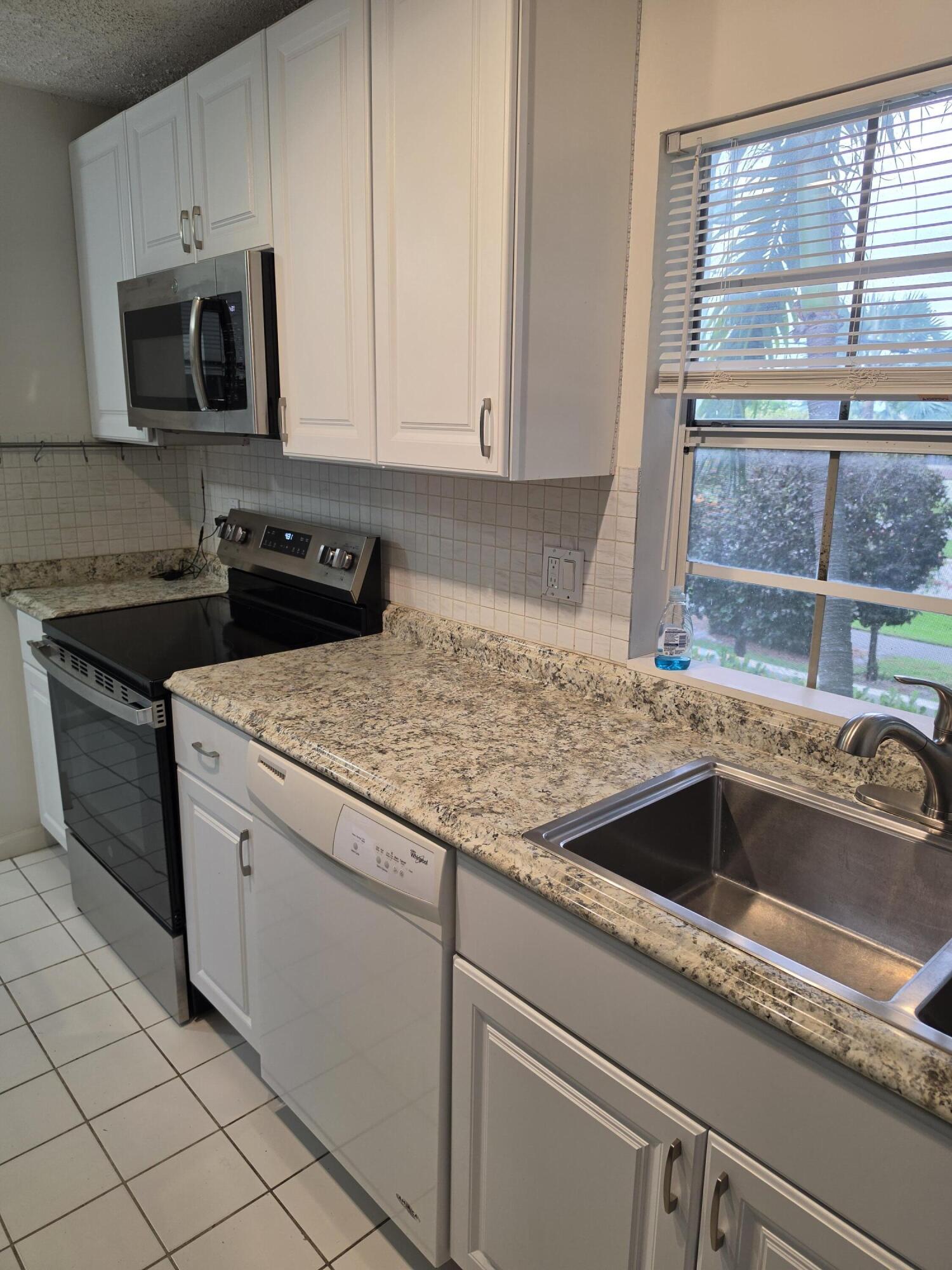 6584 Via Regina Boca Raton, FL 33433 - Photo 13 of 24 6584 VIA REGINA - UPDATED KITCHEN PHOTO