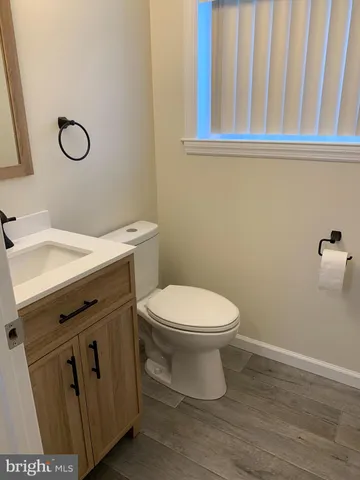 a view of a pathway of a house next to a yard