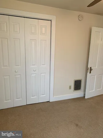 an empty room with a empty space and a window