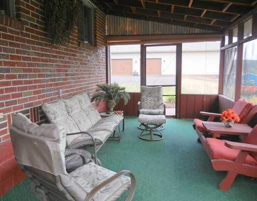 155 Country Lane Road Butler, PA 16001 - Photo 12 of 16 Sunroom. enclosed sunroom area with entrances on both ends