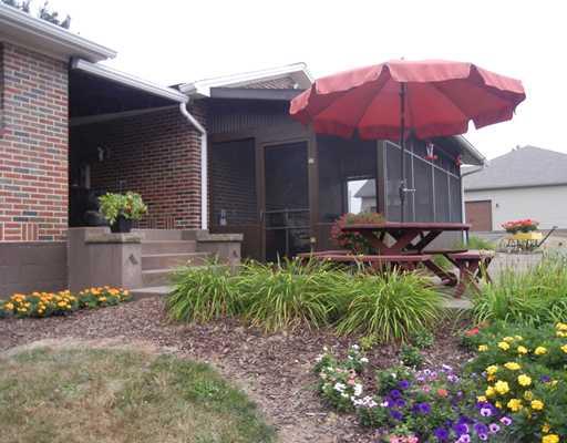 155 Country Lane Road Butler, PA 16001 - Photo 13 of 16 Land. bright flowers and plants make this outside entertainng area complete
