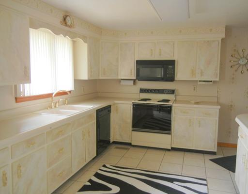 155 Country Lane Road Butler, PA 16001 - Photo 3 of 16 Kitchen. Light and bright kitchen with extra counter space and ceramic tile flooring. All aplliances included.