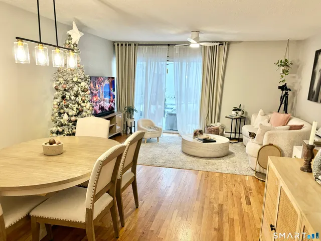 a dining room with furniture and window