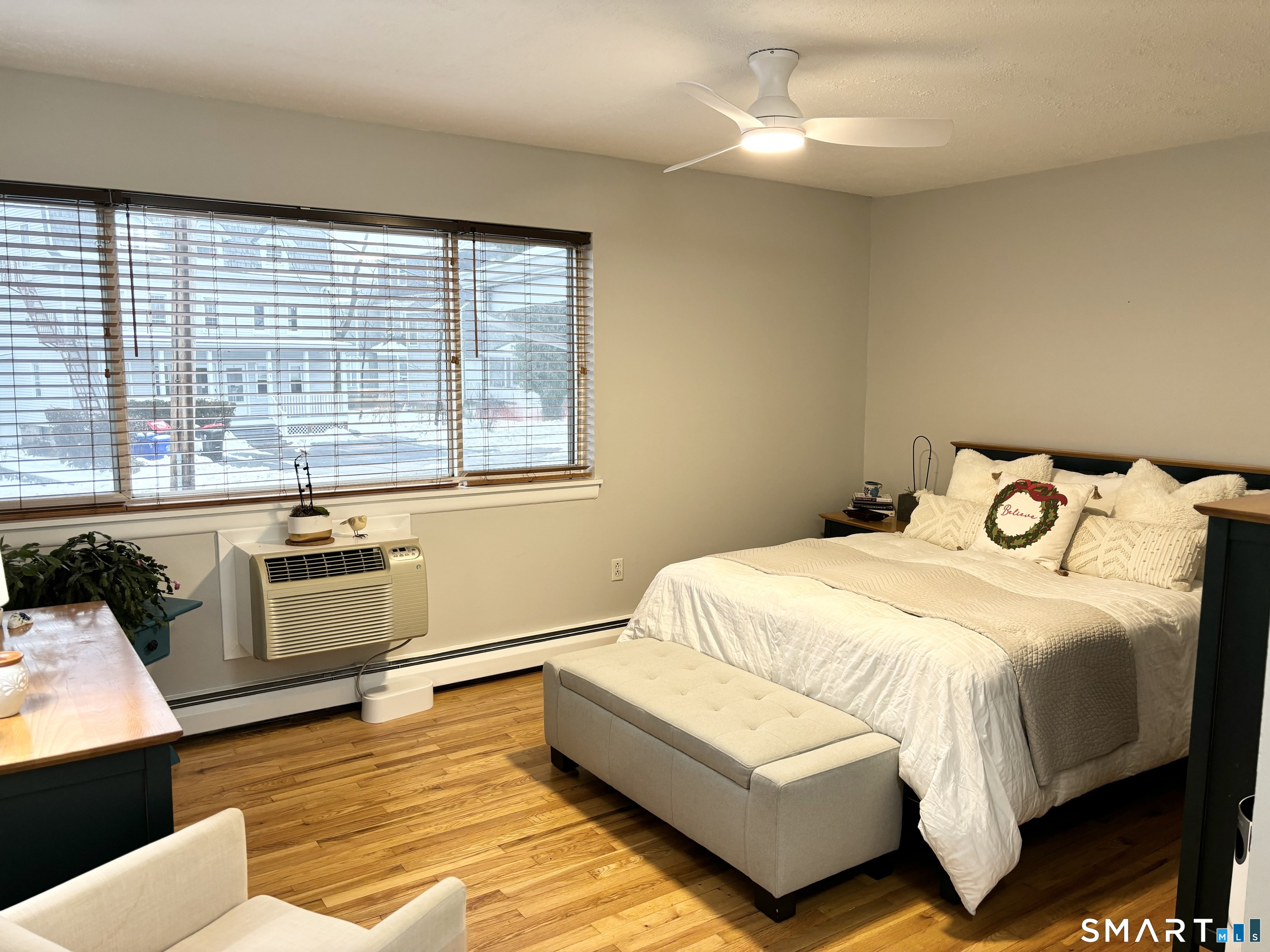 208 Flax Hill Road, Unit 12 Norwalk, CT 06854 - Photo 7 of 12 a bedroom with a bed and a couch