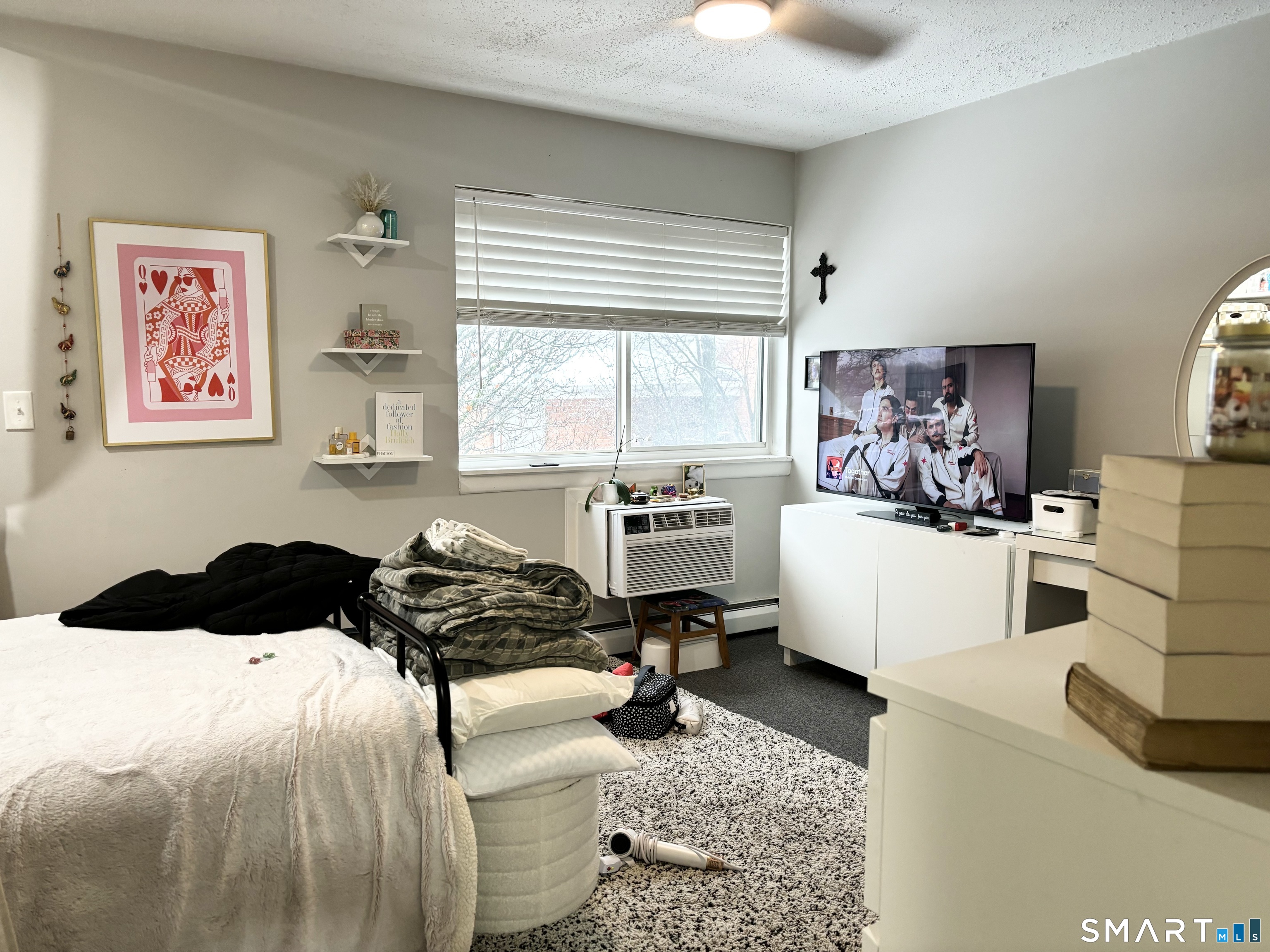 208 Flax Hill Road, Unit 12 Norwalk, CT 06854 - Photo 10 of 12 a living room with furniture and a large window