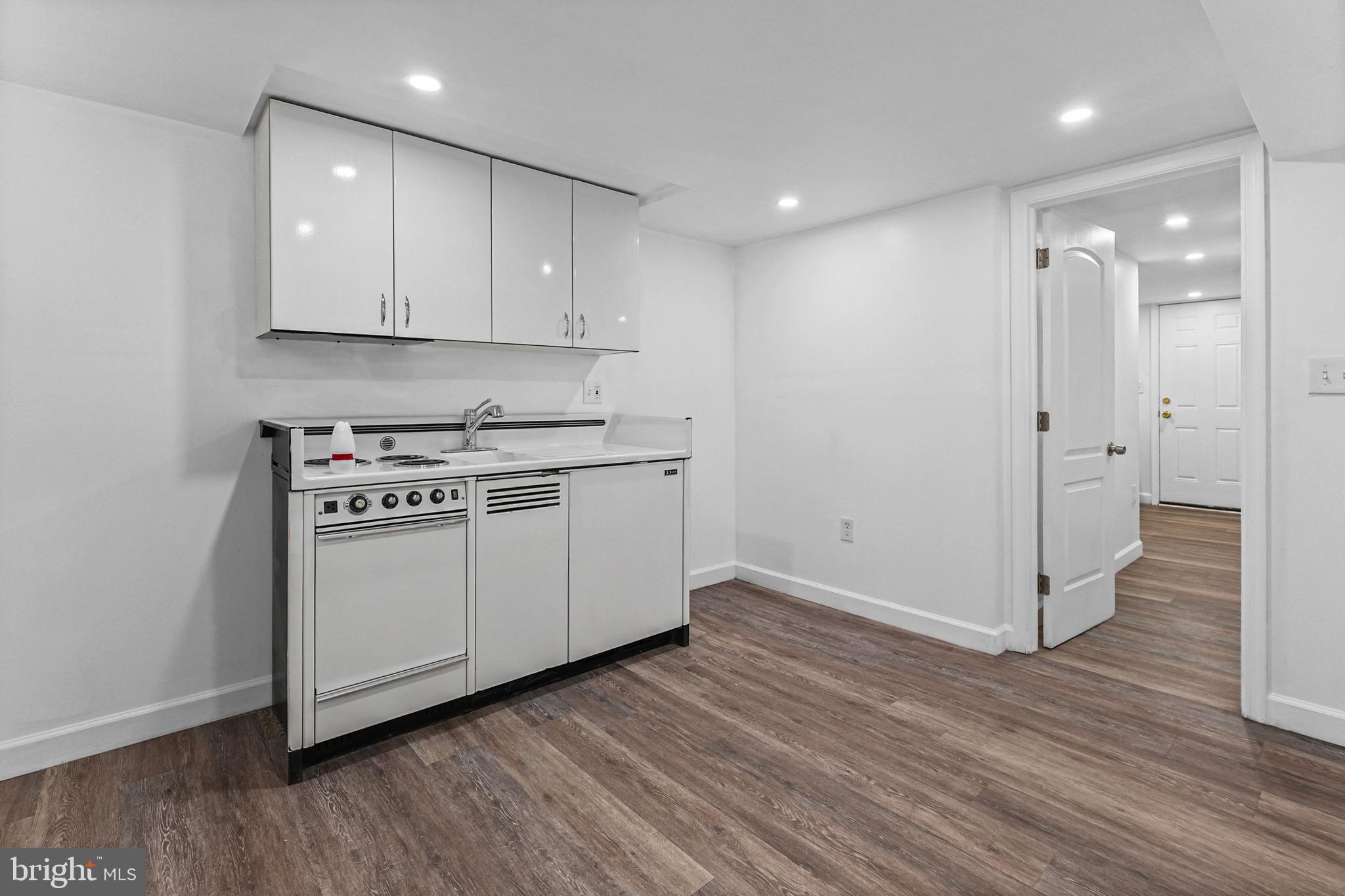 6920 Conley Street Baltimore, MD 21224 - Photo 12 of 12 a view of a kitchen with wooden floor