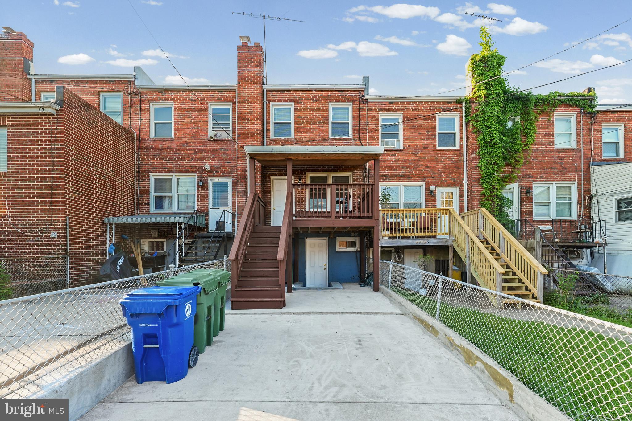 6920 Conley Street Baltimore, MD 21224 - Photo 5 of 12 a front view of a house with a park
