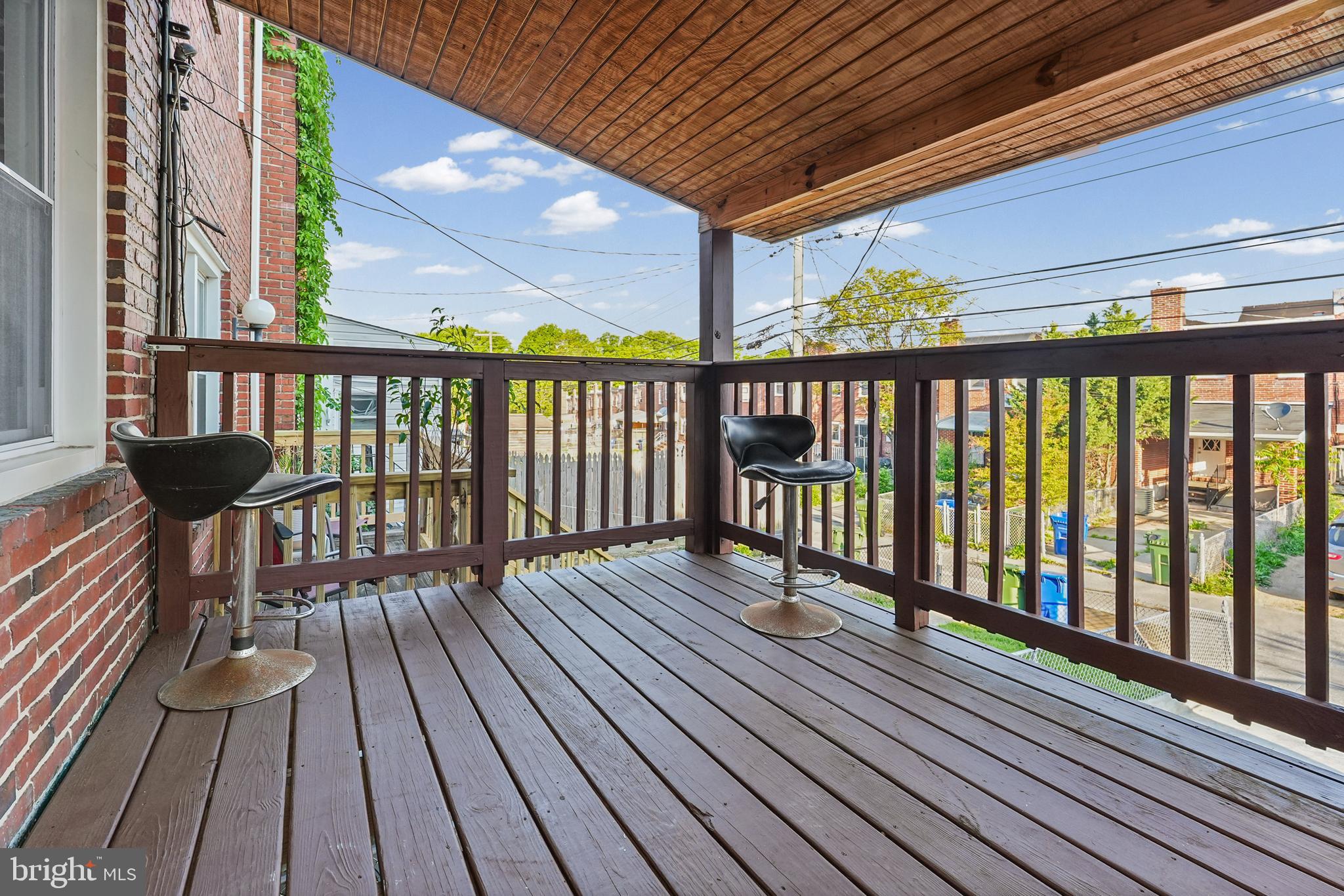 6920 Conley Street Baltimore, MD 21224 - Photo 6 of 12 a view of a balcony with wooden floor