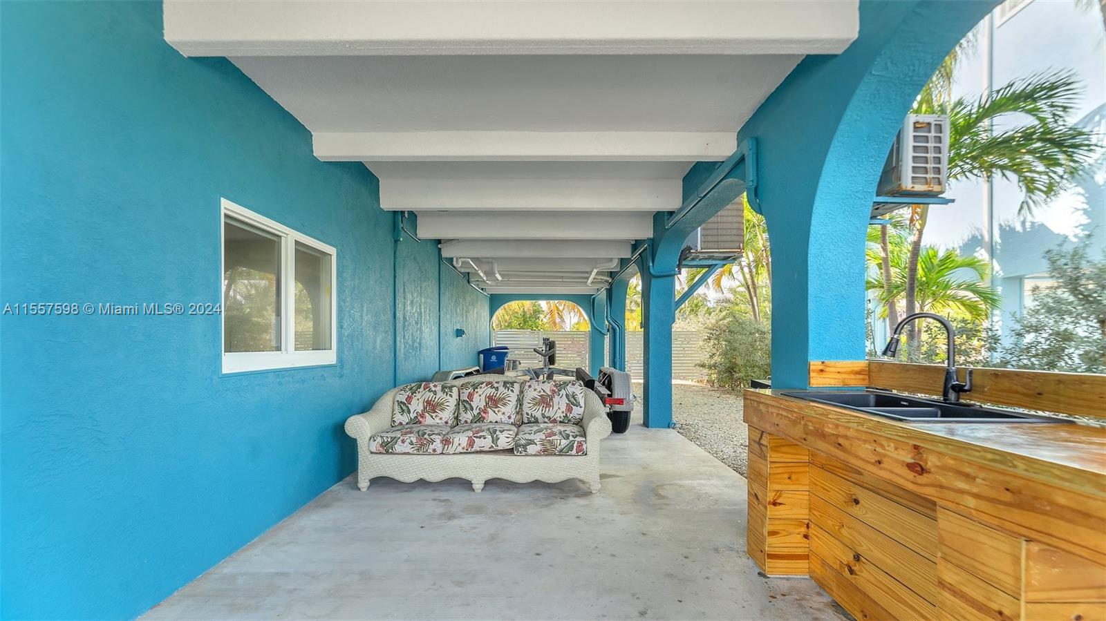 441 La Fitte Road Summerland Key, FL 33042 - Photo 12 of 81 a bedroom with a bed and a large window