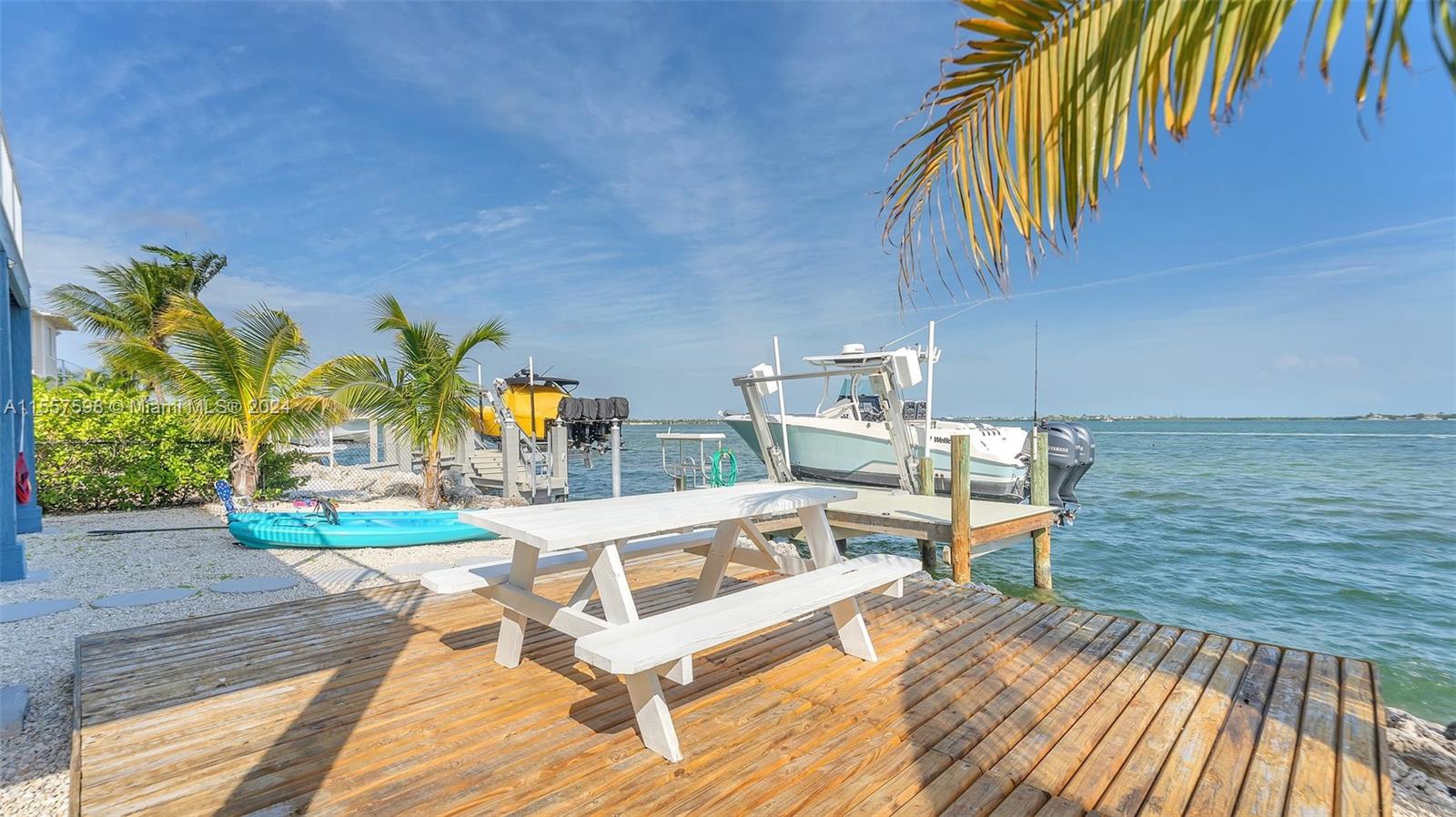 441 La Fitte Road Summerland Key, FL 33042 - Photo 15 of 81 a view of a swimming pool with a patio and a yard