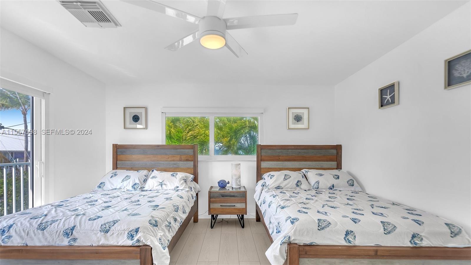 441 La Fitte Road Summerland Key, FL 33042 - Photo 23 of 81 a bedroom with a bed and painting on the wall