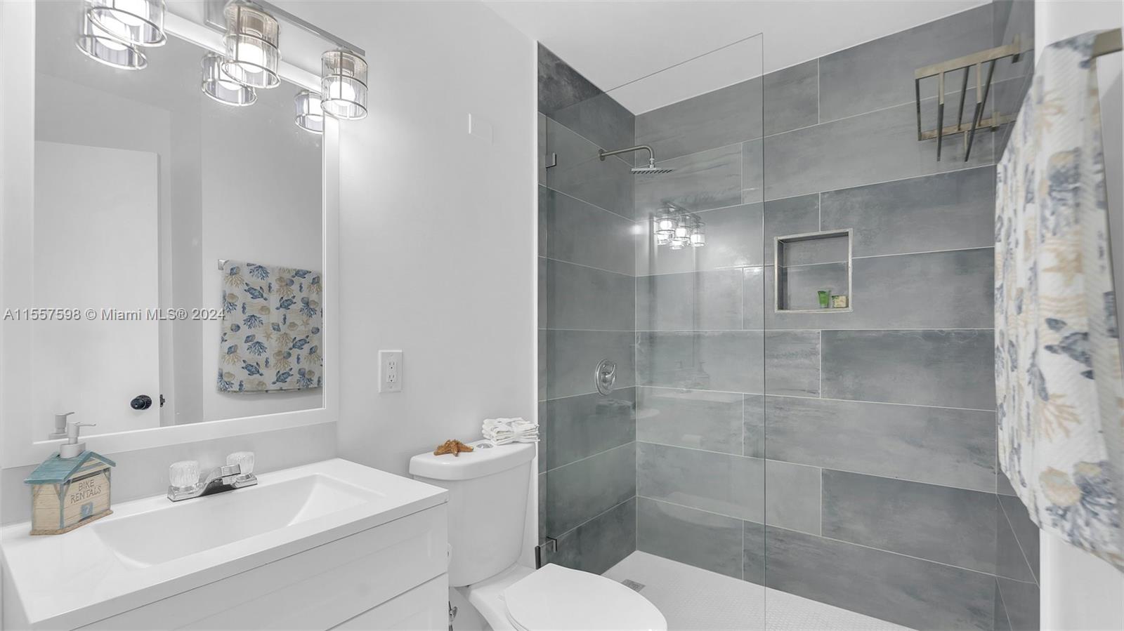 441 La Fitte Road Summerland Key, FL 33042 - Photo 26 of 81 a bathroom with a sink toilet and shower