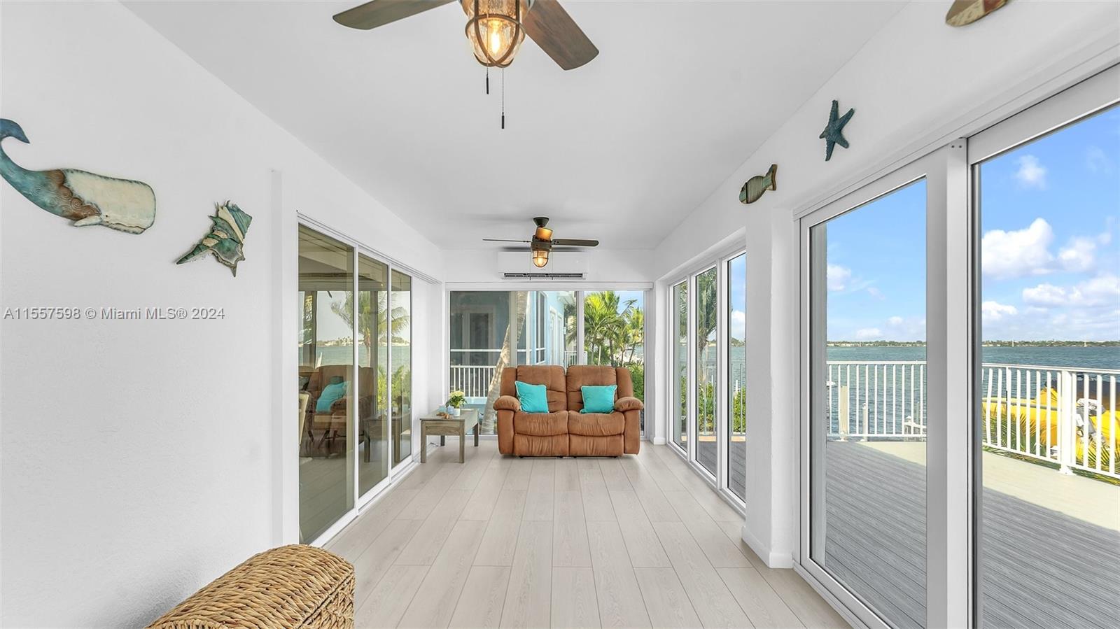 441 La Fitte Road Summerland Key, FL 33042 - Photo 30 of 81 a living room with furniture and a large window