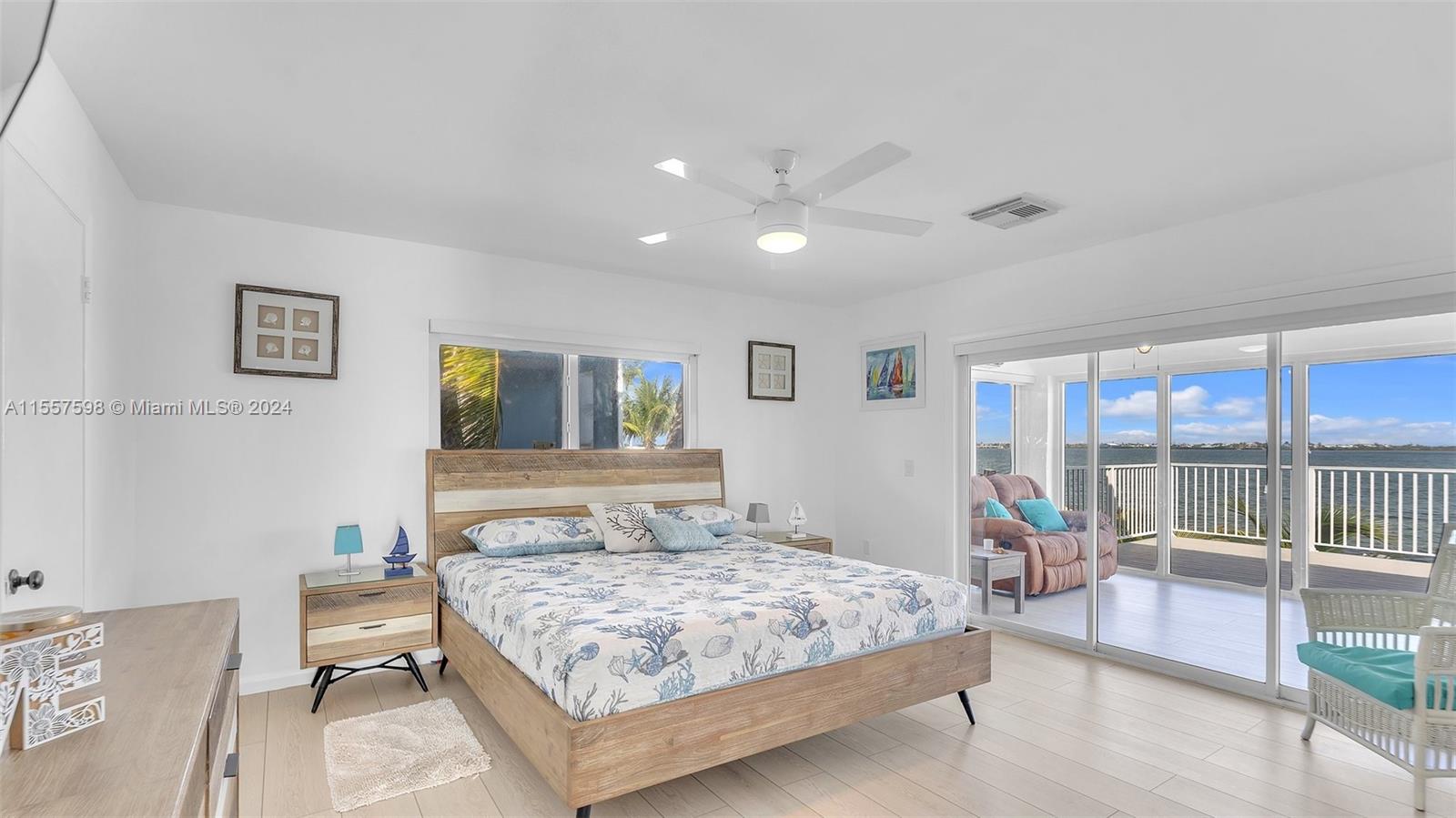 441 La Fitte Road Summerland Key, FL 33042 - Photo 34 of 81 a bedroom with a large bed and a tv