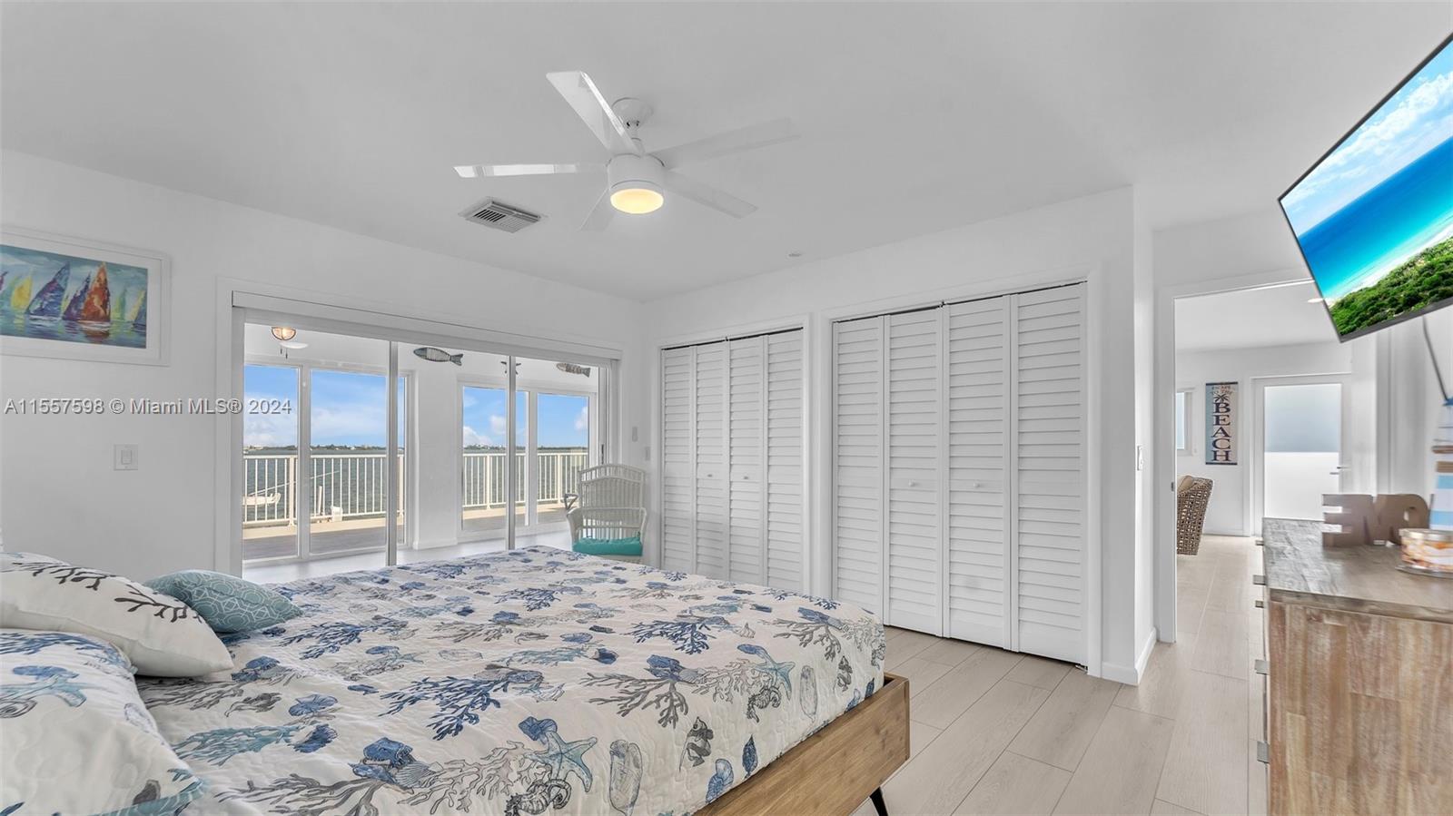 441 La Fitte Road Summerland Key, FL 33042 - Photo 38 of 81 a bedroom with a bed and a flat screen tv