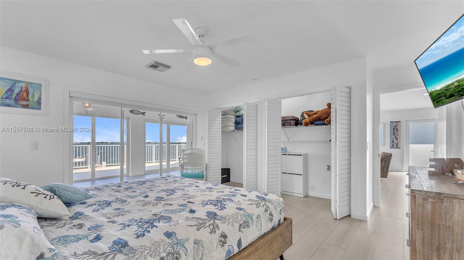 441 La Fitte Road Summerland Key, FL 33042 - Photo 39 of 81 a bedroom with a bed and a flat screen tv