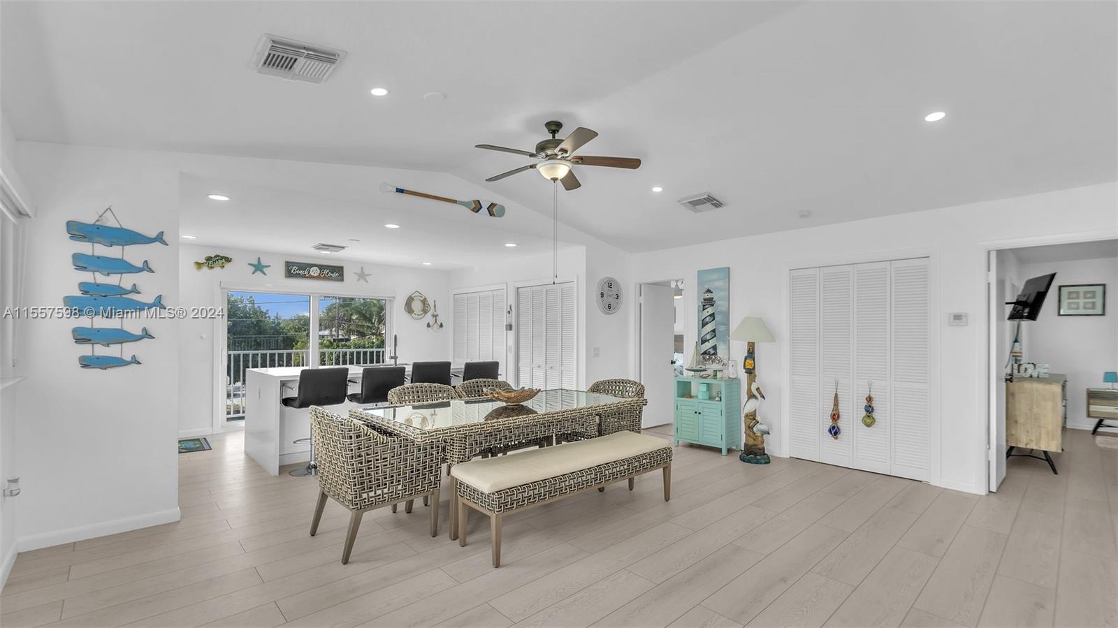 441 La Fitte Road Summerland Key, FL 33042 - Photo 45 of 81 a living room with furniture a table and wooden floor