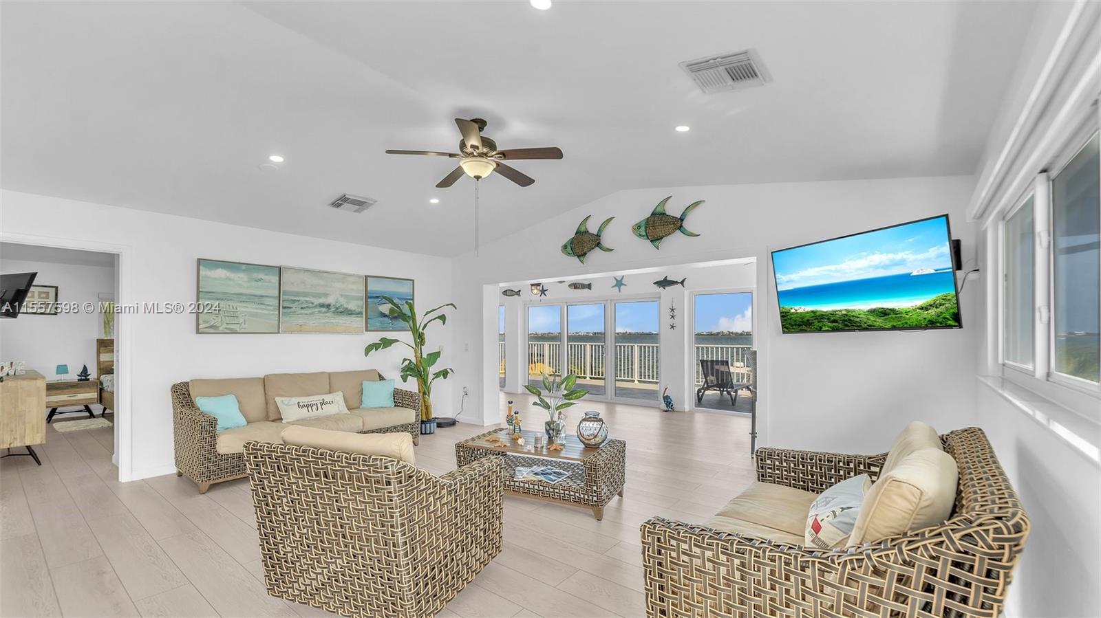 441 La Fitte Road Summerland Key, FL 33042 - Photo 47 of 81 a living room with furniture and a flat screen tv