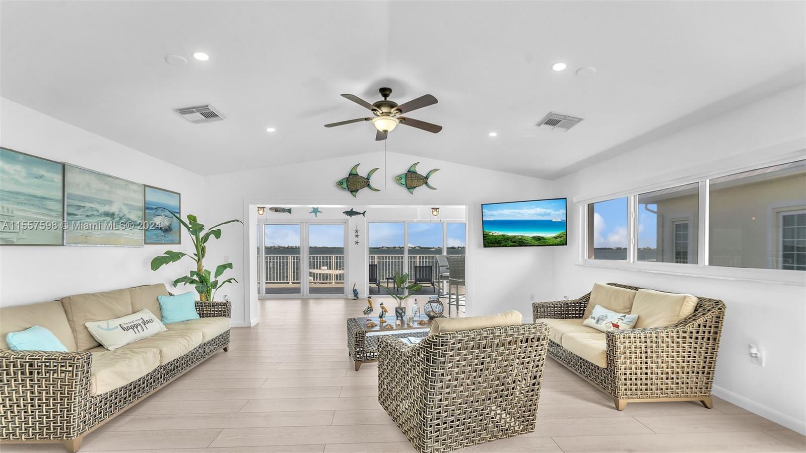 441 La Fitte Road Summerland Key, FL 33042 - Photo 49 of 81 a living room with furniture a dining table and a fireplace