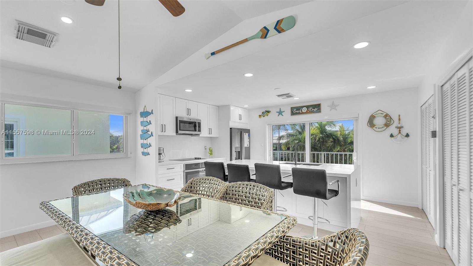 441 La Fitte Road Summerland Key, FL 33042 - Photo 50 of 81 a living room with furniture a rug and a chandelier