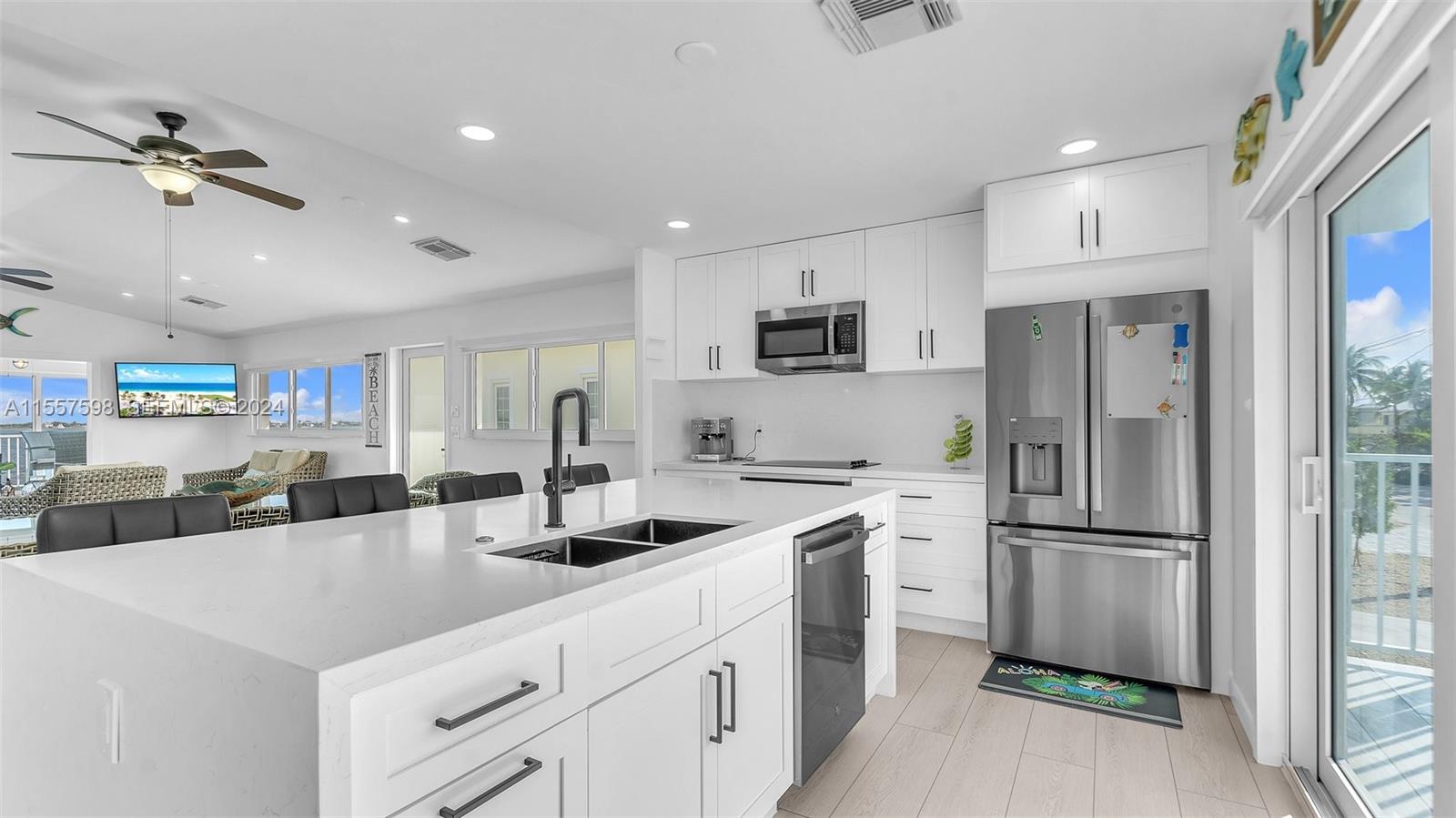 441 La Fitte Road Summerland Key, FL 33042 - Photo 54 of 81 a kitchen with stainless steel appliances a refrigerator sink and microwave