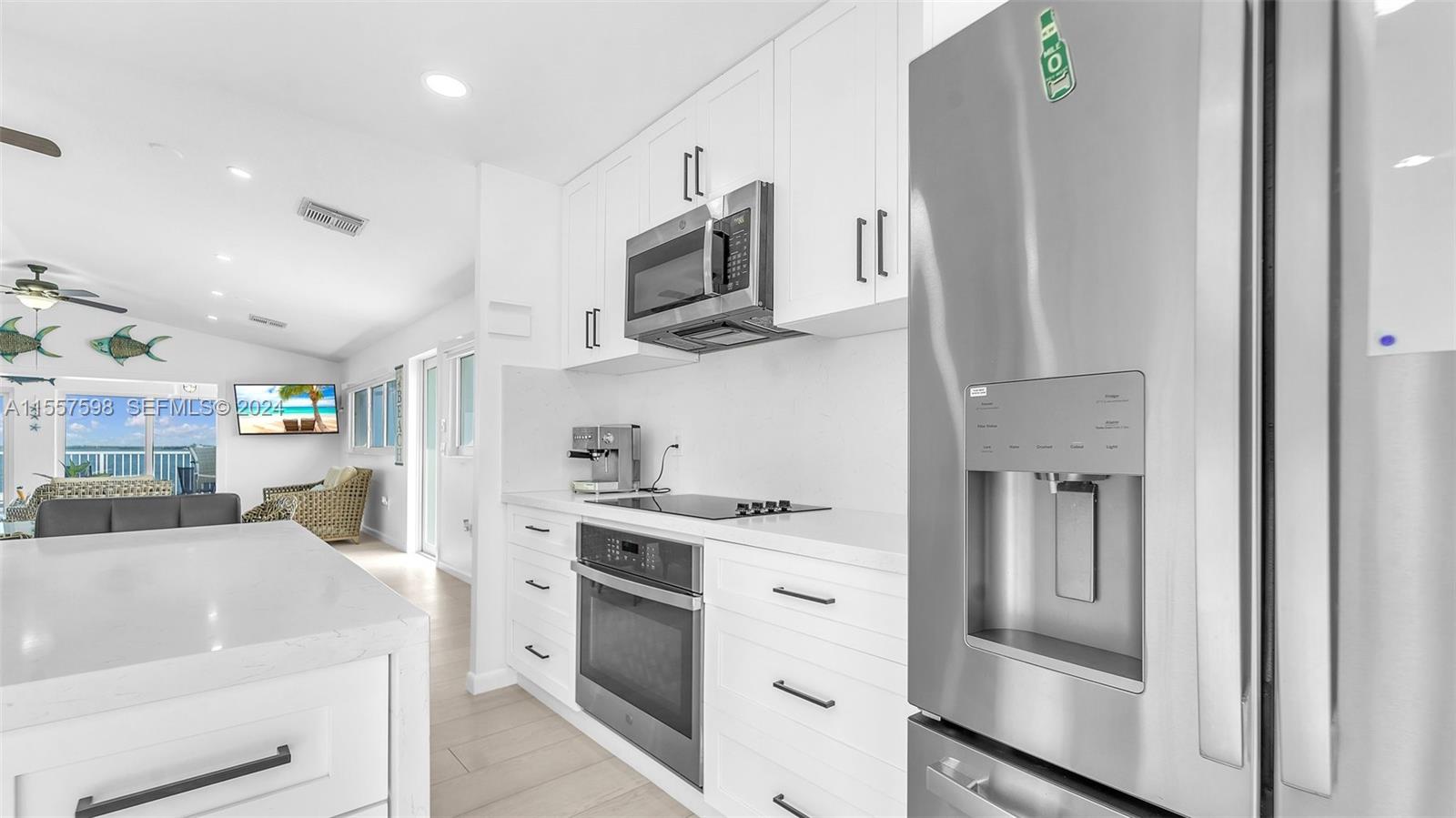 441 La Fitte Road Summerland Key, FL 33042 - Photo 58 of 81 a kitchen with stainless steel appliances granite countertop a refrigerator stove and sink