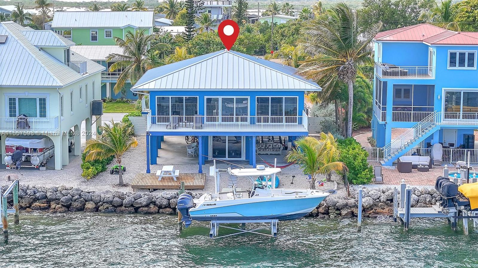 441 La Fitte Road Summerland Key, FL 33042 - Photo 81 of 81 a front view of a house with garden water fountain and sitting area