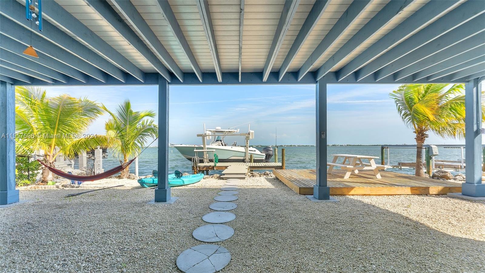 441 La Fitte Road Summerland Key, FL 33042 - Photo 9 of 81 a view of a swimming pool with a patio and a backyard