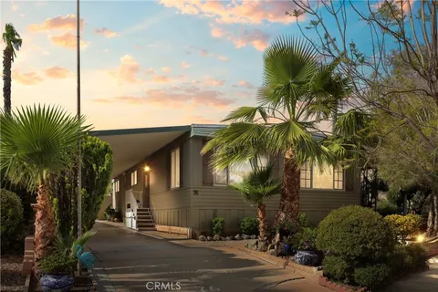 a view of a house with a tree